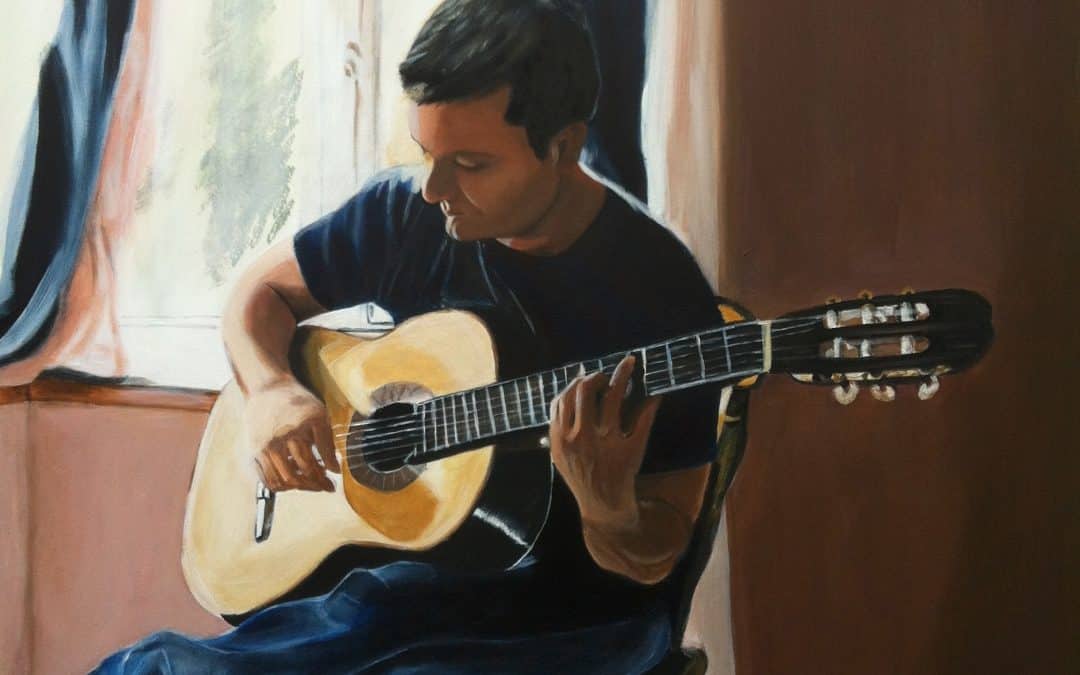 RAGAZZO CHE SUONA LA CHITARRA